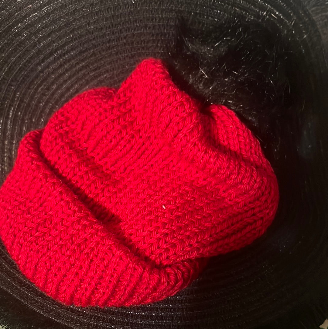 Red beanie with black pompom