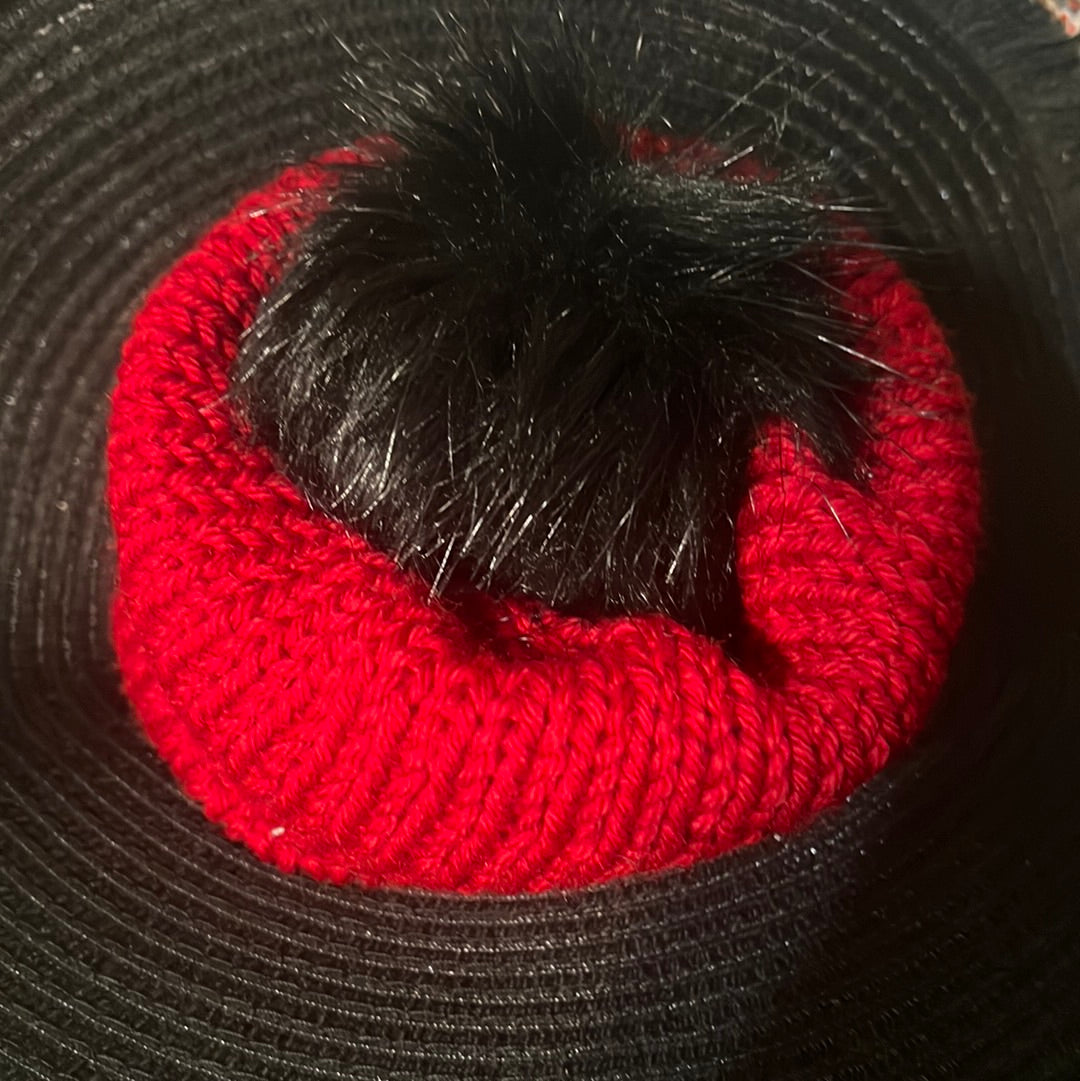 Red beanie with black pompom